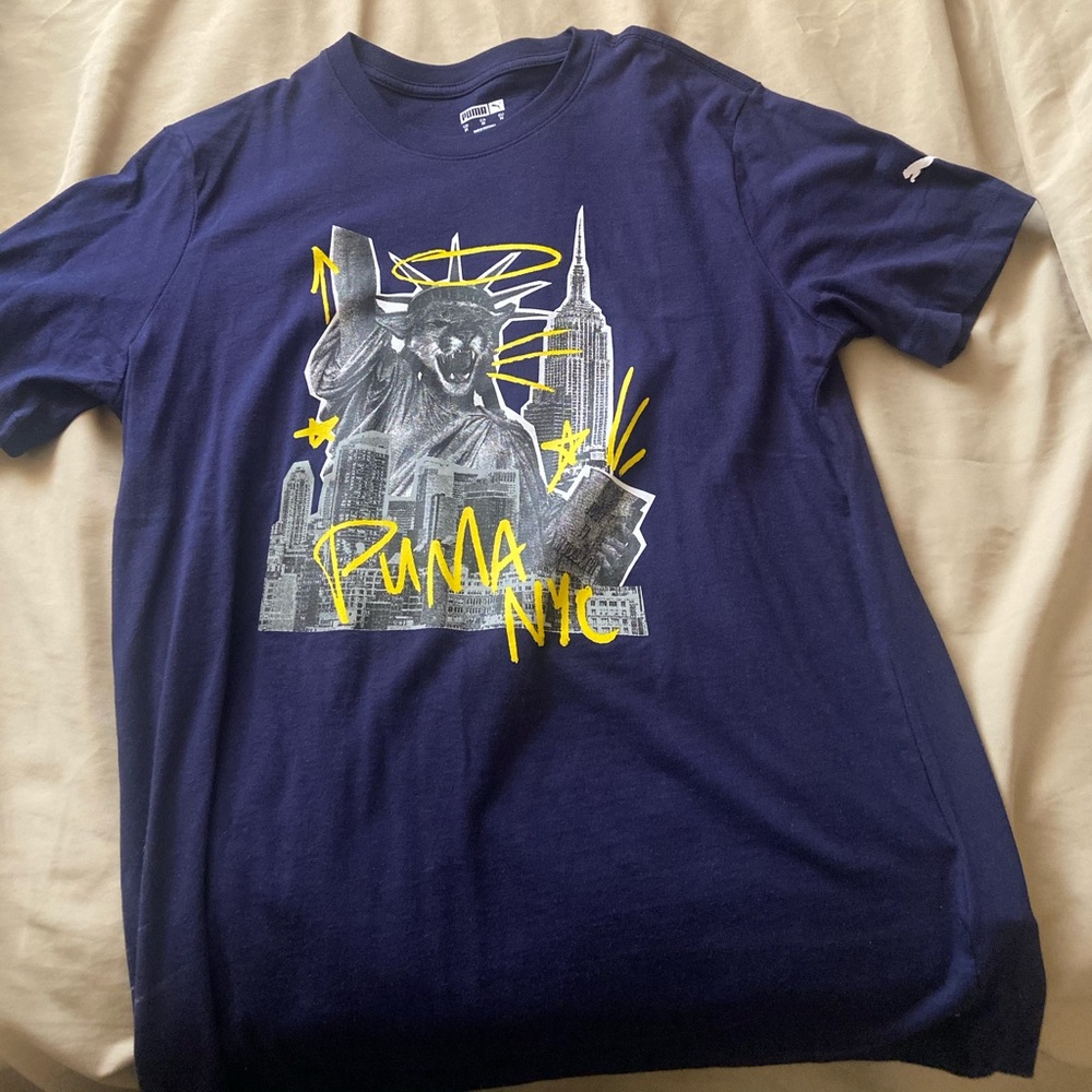 Puma Shirt with Statue of Liberty design.